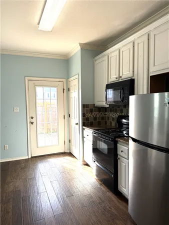 a view of a kitchen counter space a sink and dishwasher