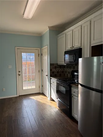 a view of an empty room and a window
