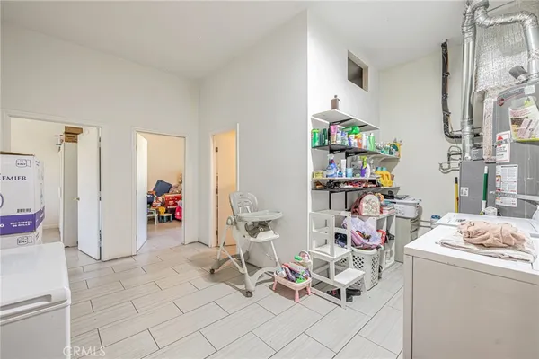 a room with furniture a rug and a closet