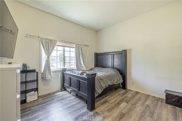 a bedroom with a bed and furniture