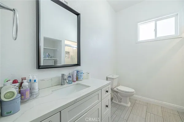 a bathroom with a toilet and a sink
