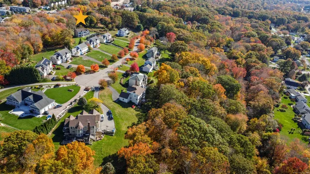 an aerial view of residential houses with outdoor space