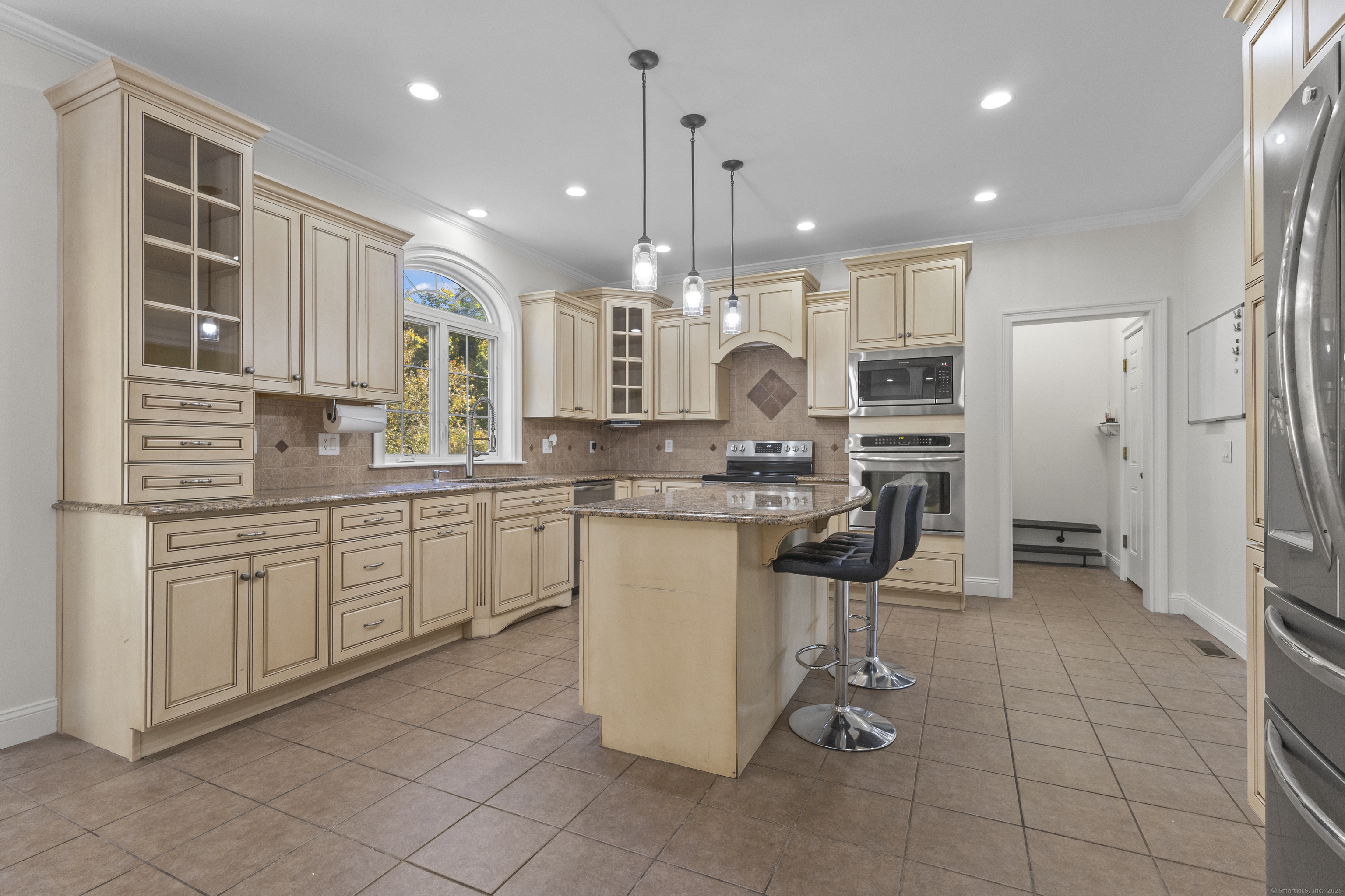 5 Two Mile Hill Road Waterford, CT 06385 - Photo 4 of 21 a kitchen with a refrigerator a sink and cabinets