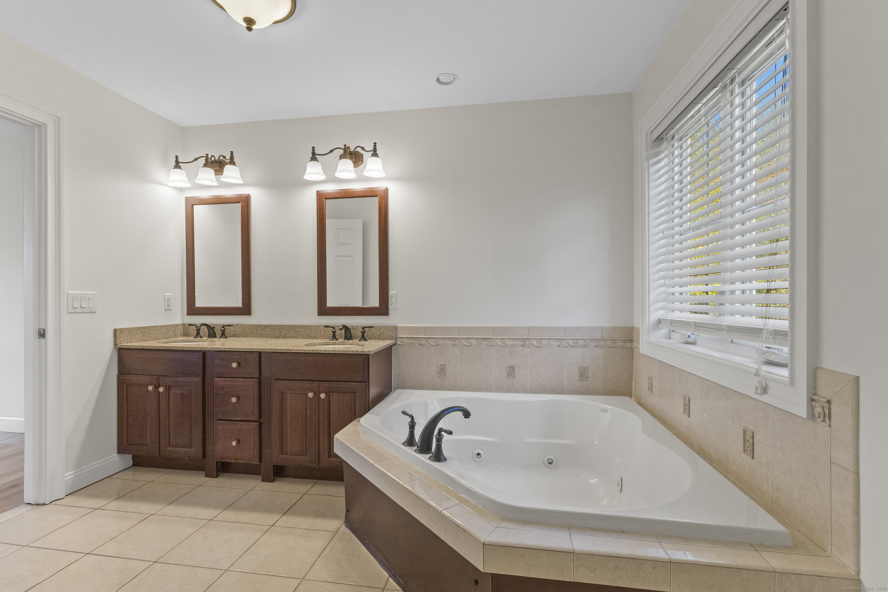 5 Two Mile Hill Road Waterford, CT 06385 - Photo 9 of 21 a bathroom with a tub a sink and a mirror