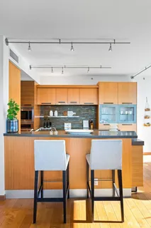 a large kitchen with a large window