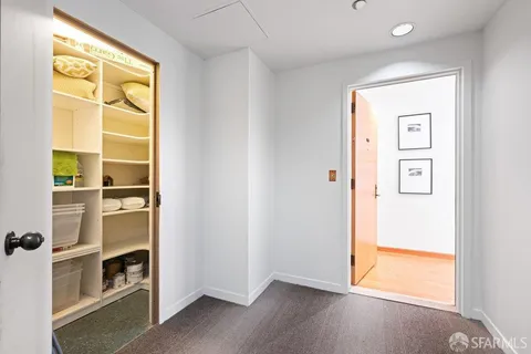 a view of a kitchen with a sink and living room