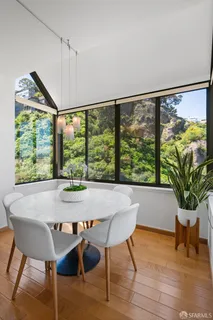 a kitchen with stainless steel appliances granite countertop a sink and a window