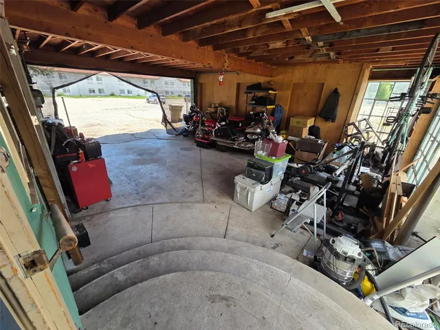 a front view of a house with yard and green space