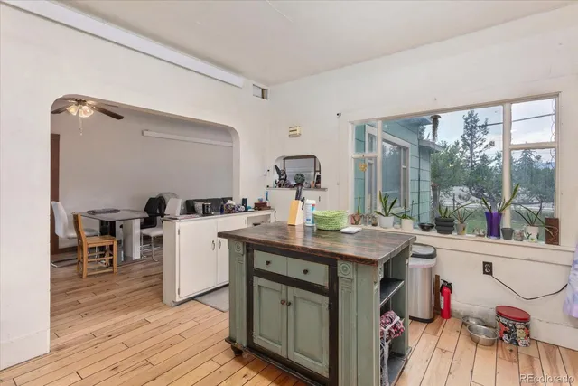 a room with a sink and cabinets