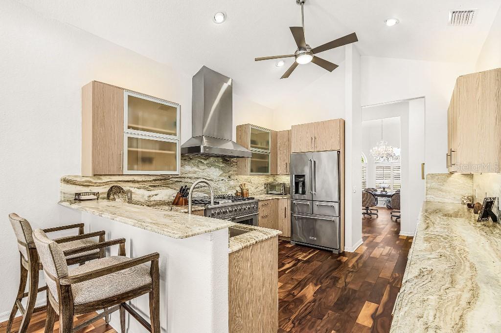 4001 Marianne Key Road Punta Gorda, FL 33955 - Photo 13 of 29 a kitchen with refrigerator and cabinets