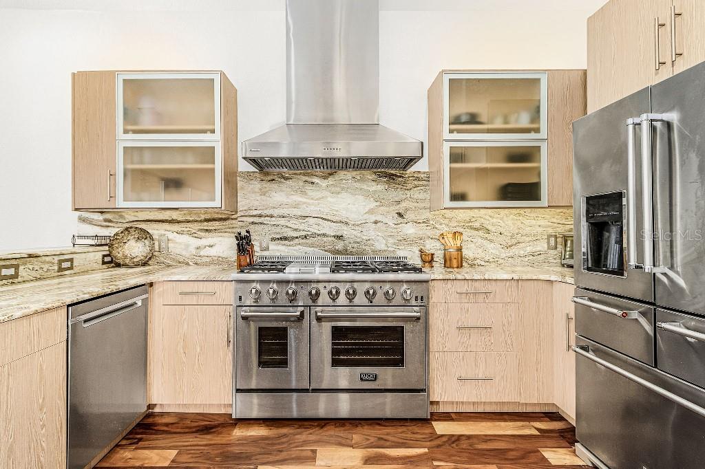 4001 Marianne Key Road Punta Gorda, FL 33955 - Photo 15 of 29 a kitchen with stainless steel appliances granite countertop a stove and a refrigerator