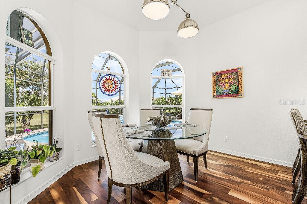 4001 Marianne Key Road Punta Gorda, FL 33955 - Photo 16 of 29 a view of a dining room with furniture window and wooden floor