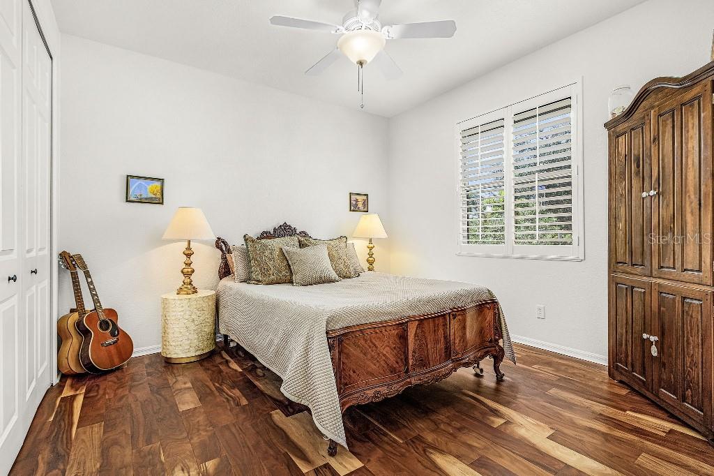 4001 Marianne Key Road Punta Gorda, FL 33955 - Photo 19 of 29 a bedroom with a bed and wooden floor