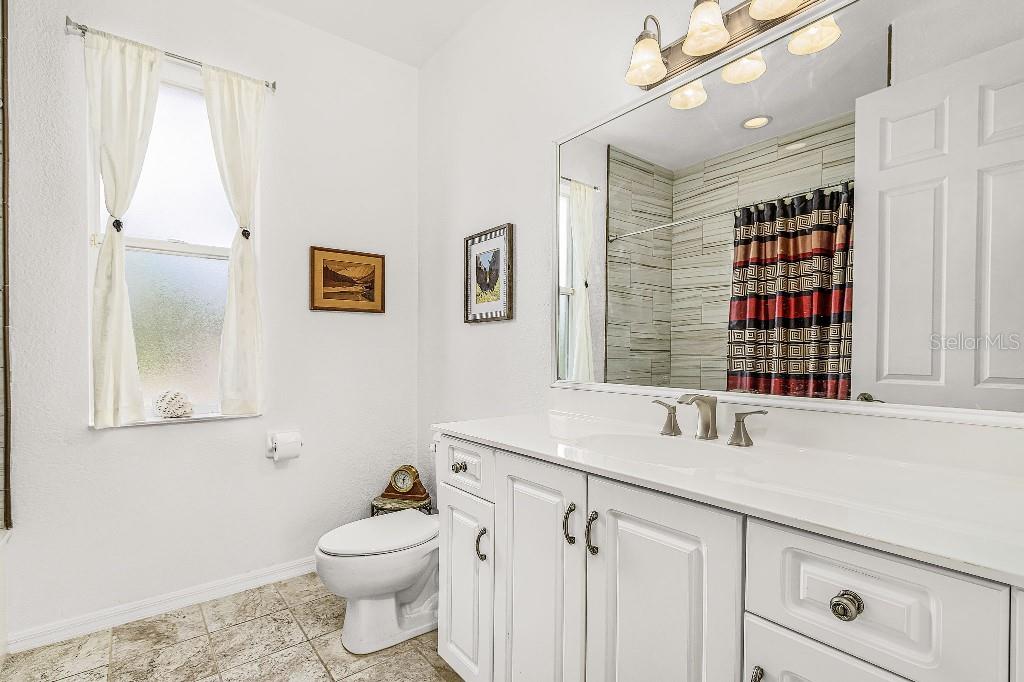 4001 Marianne Key Road Punta Gorda, FL 33955 - Photo 20 of 29 a bathroom with a sink a toilet and shower