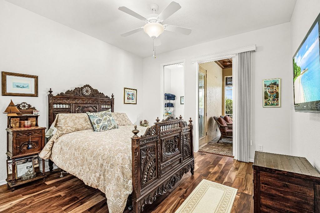 4001 Marianne Key Road Punta Gorda, FL 33955 - Photo 22 of 29 a bedroom with a bed and wooden floor