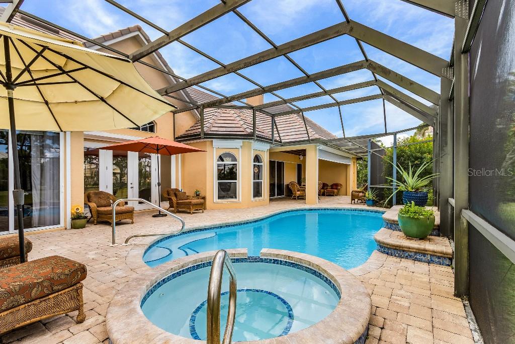 4001 Marianne Key Road Punta Gorda, FL 33955 - Photo 24 of 29 a view of a patio with swimming pool table and chairs