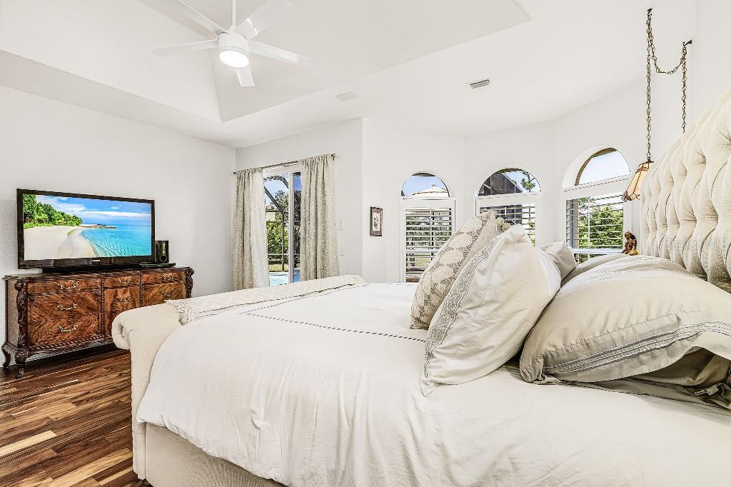 4001 Marianne Key Road Punta Gorda, FL 33955 - Photo 6 of 29 a bedroom with a bed and a flat screen tv