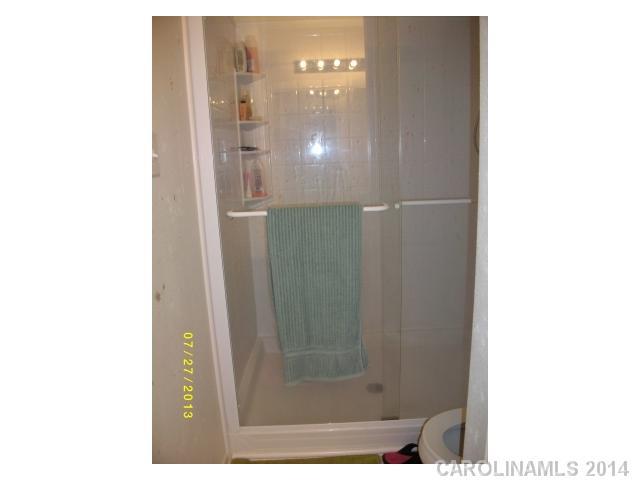 8624 Rockmoor Ridge Road Charlotte, NC 28215 - Photo 7 of 7 a bathroom with a mirror