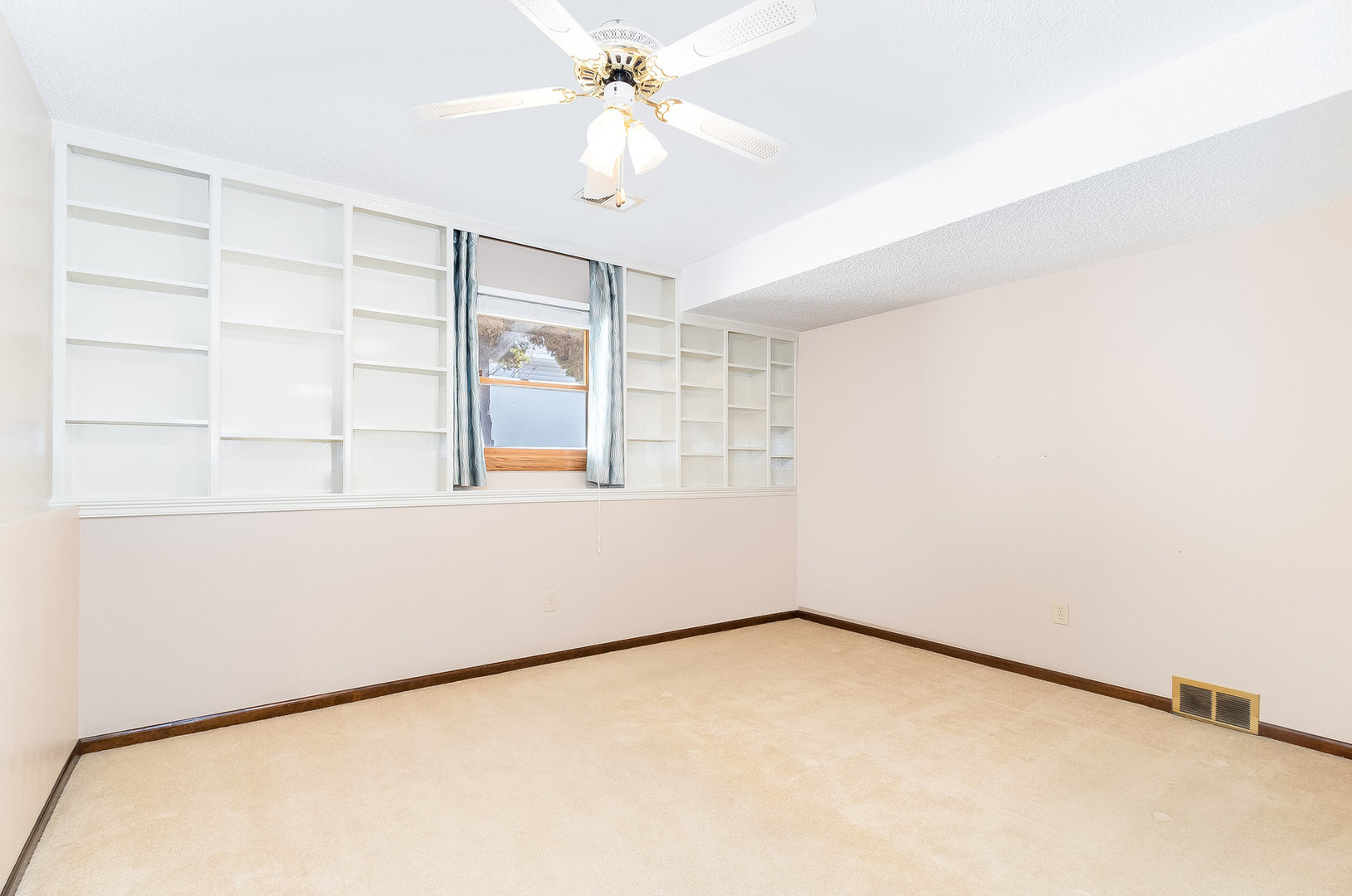 25121 West Willow Drive Plainfield, IL 60544 - Photo 19 of 28 a view of an empty room with a window