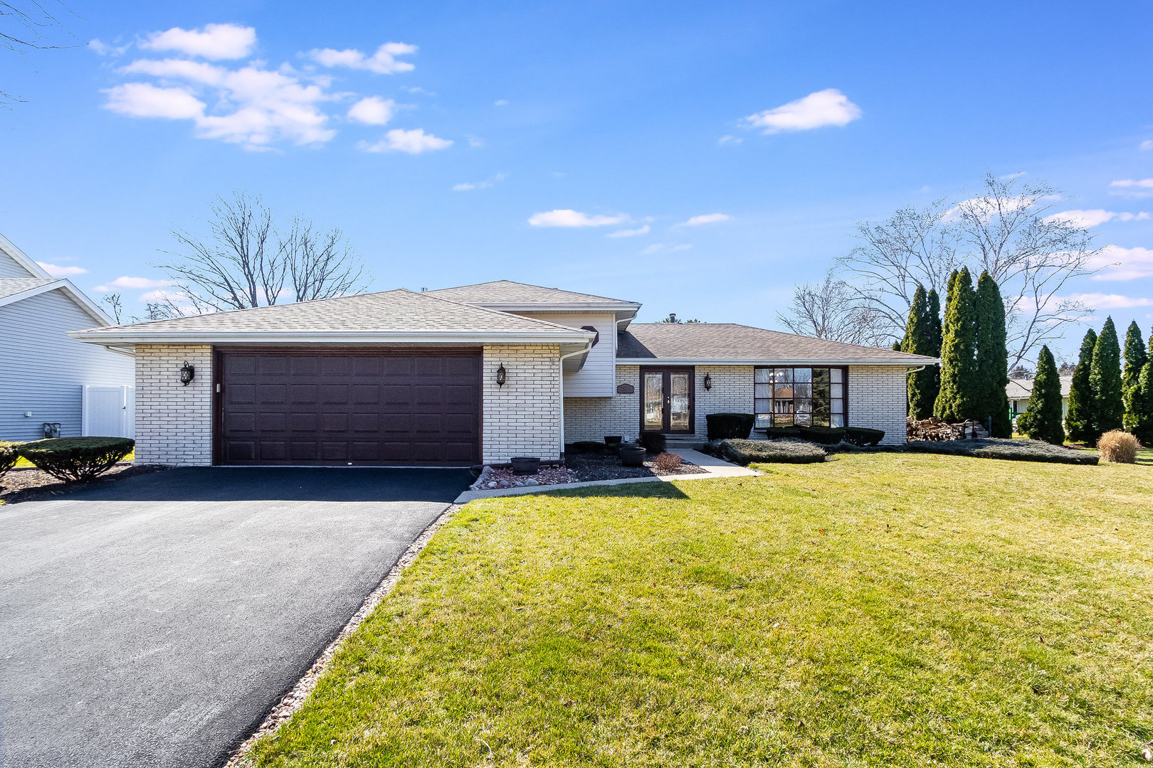 25121 West Willow Drive Plainfield, IL 60544 - Photo 2 of 28 a front view of a house with yard and balcony