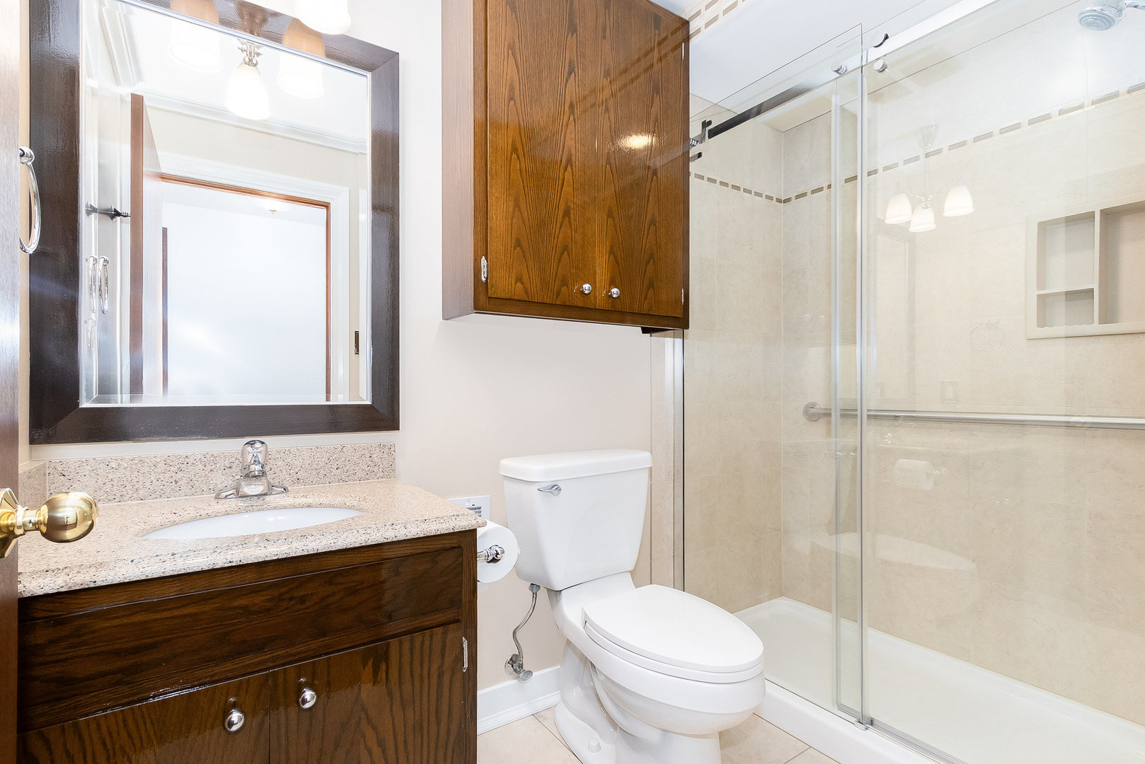 25121 West Willow Drive Plainfield, IL 60544 - Photo 22 of 28 a bathroom with a granite countertop sink toilet and shower