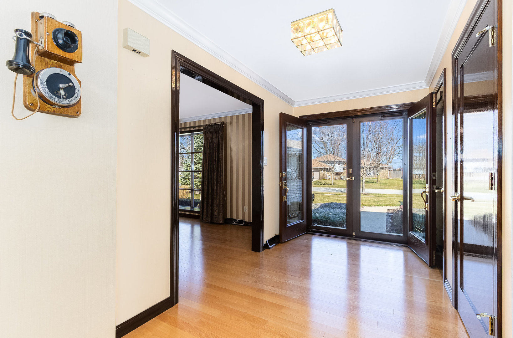 25121 West Willow Drive Plainfield, IL 60544 - Photo 3 of 28 a view of an entryway with wooden floor