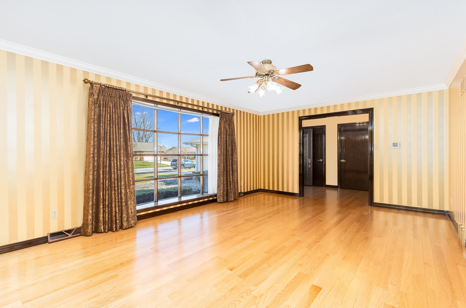 25121 West Willow Drive Plainfield, IL 60544 - Photo 6 of 28 a view of an empty room with a window