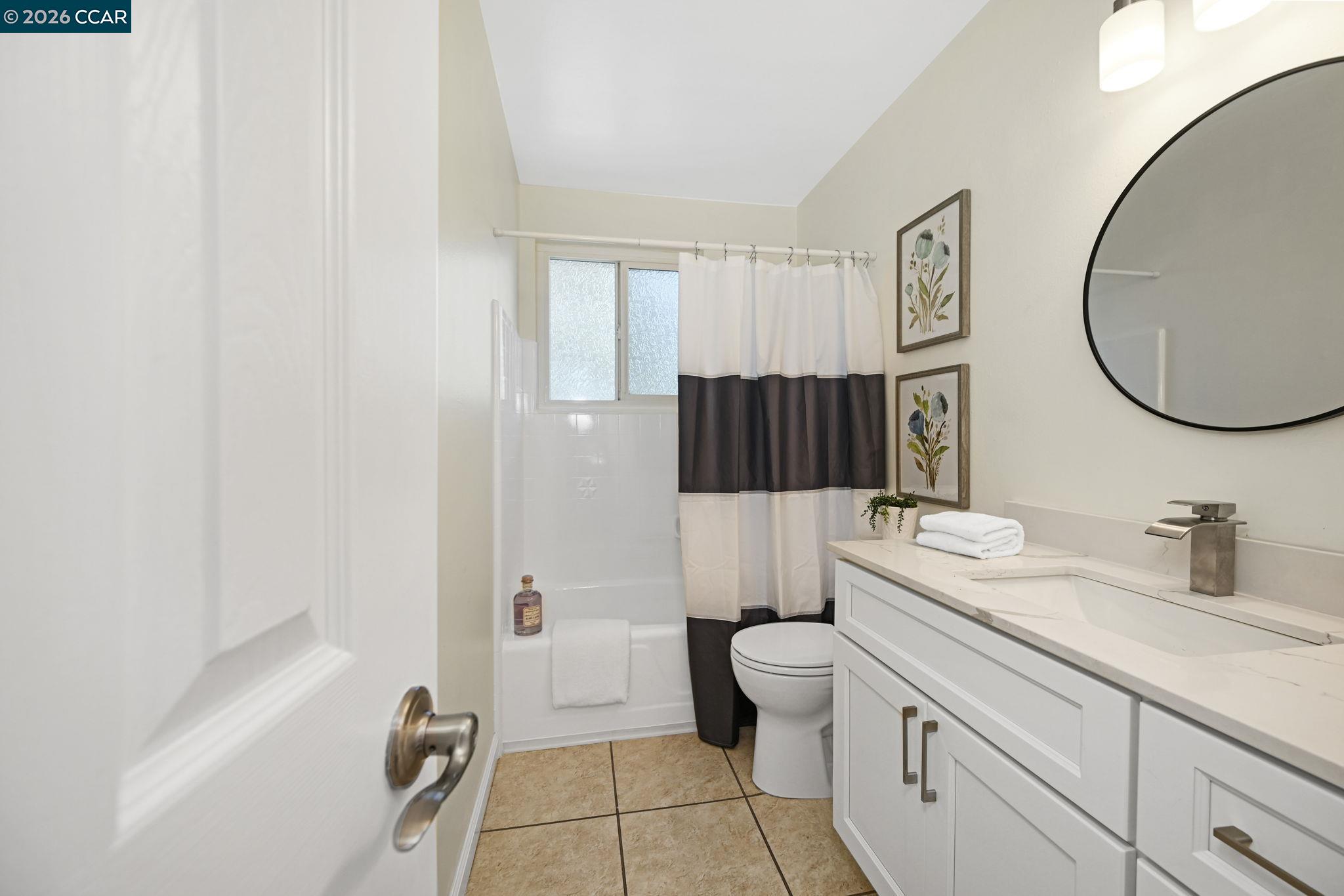 414 Peppertree Road Walnut Creek, CA 94598 - Photo 23 of 49 a bathroom with a double vanity sink toilet and shower