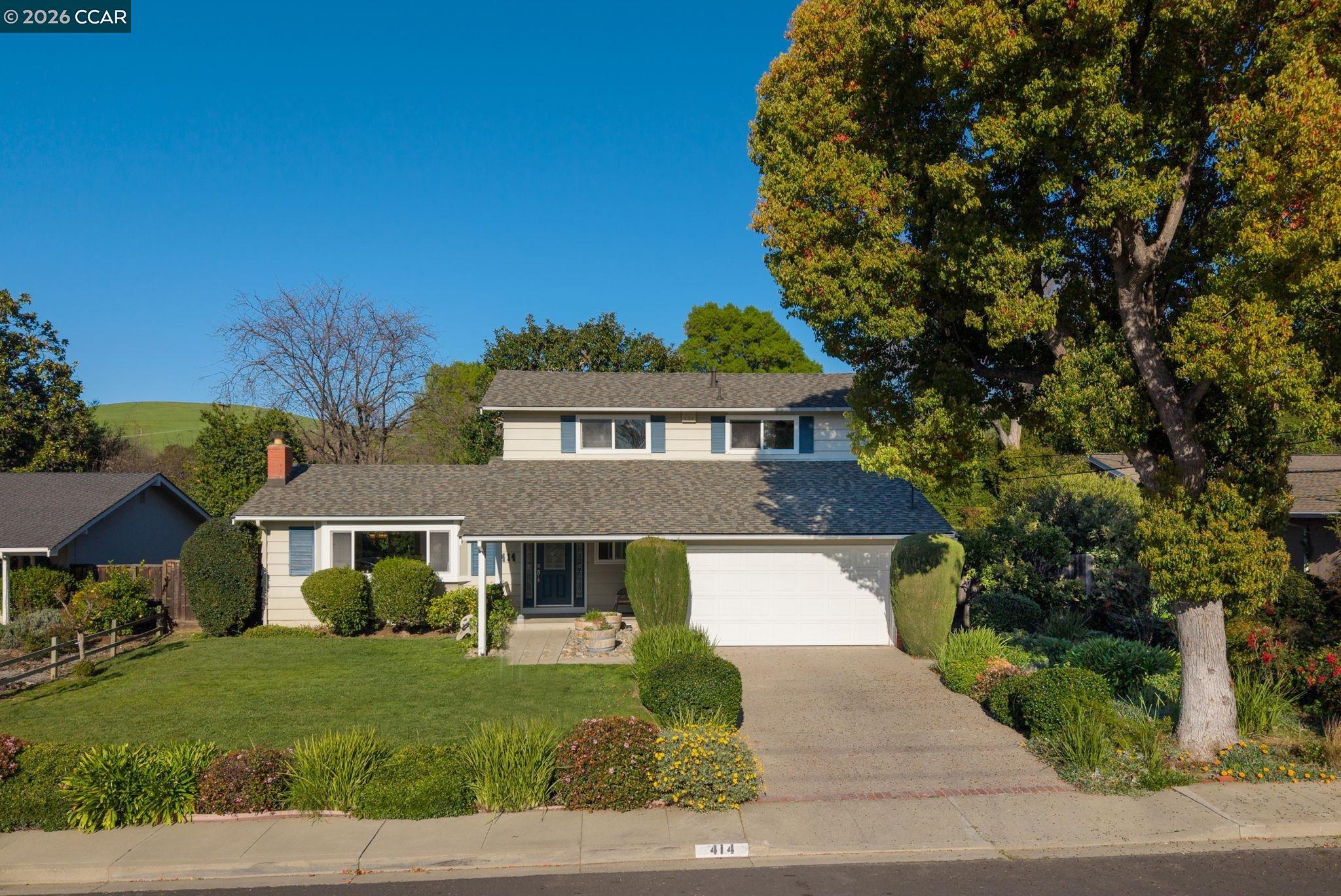 414 Peppertree Road Walnut Creek, CA 94598 - Photo 3 of 49 a front view of a house with a yard