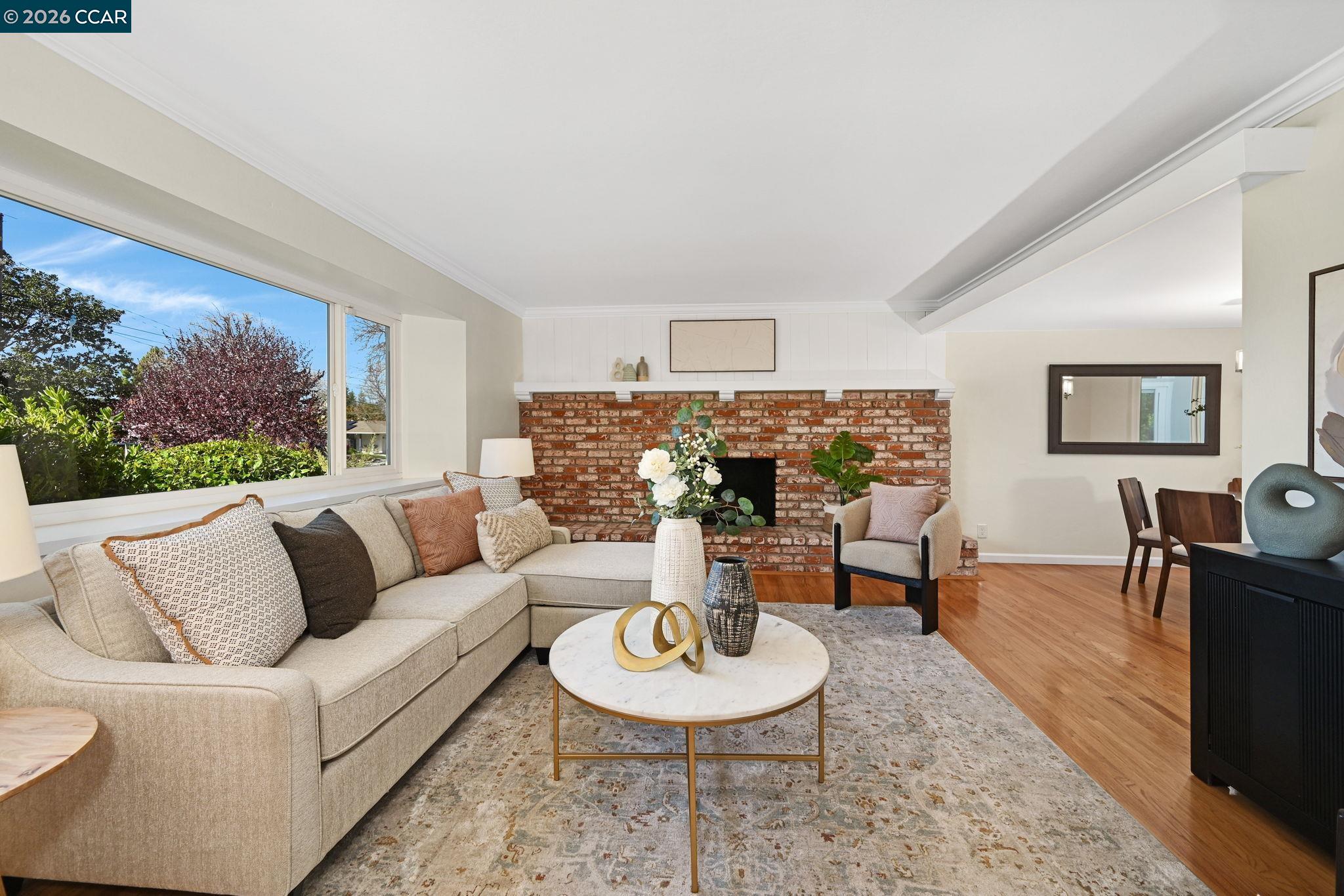 414 Peppertree Road Walnut Creek, CA 94598 - Photo 6 of 49 a living room with furniture a rug and a fireplace