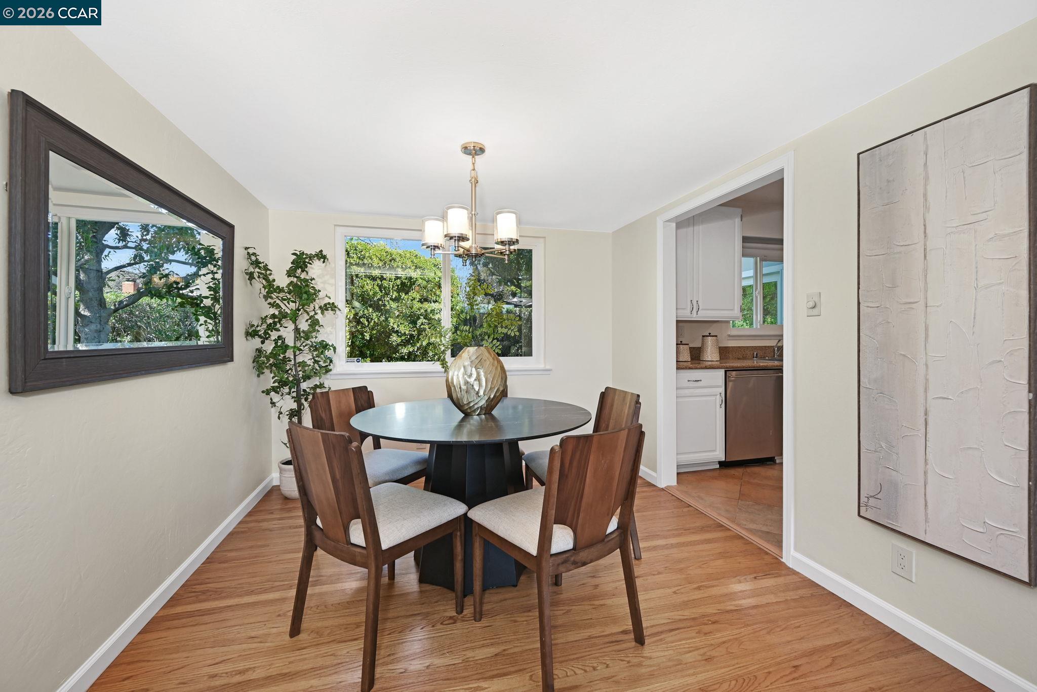 414 Peppertree Road Walnut Creek, CA 94598 - Photo 9 of 49 a view of a dining room with furniture window and wooden floor