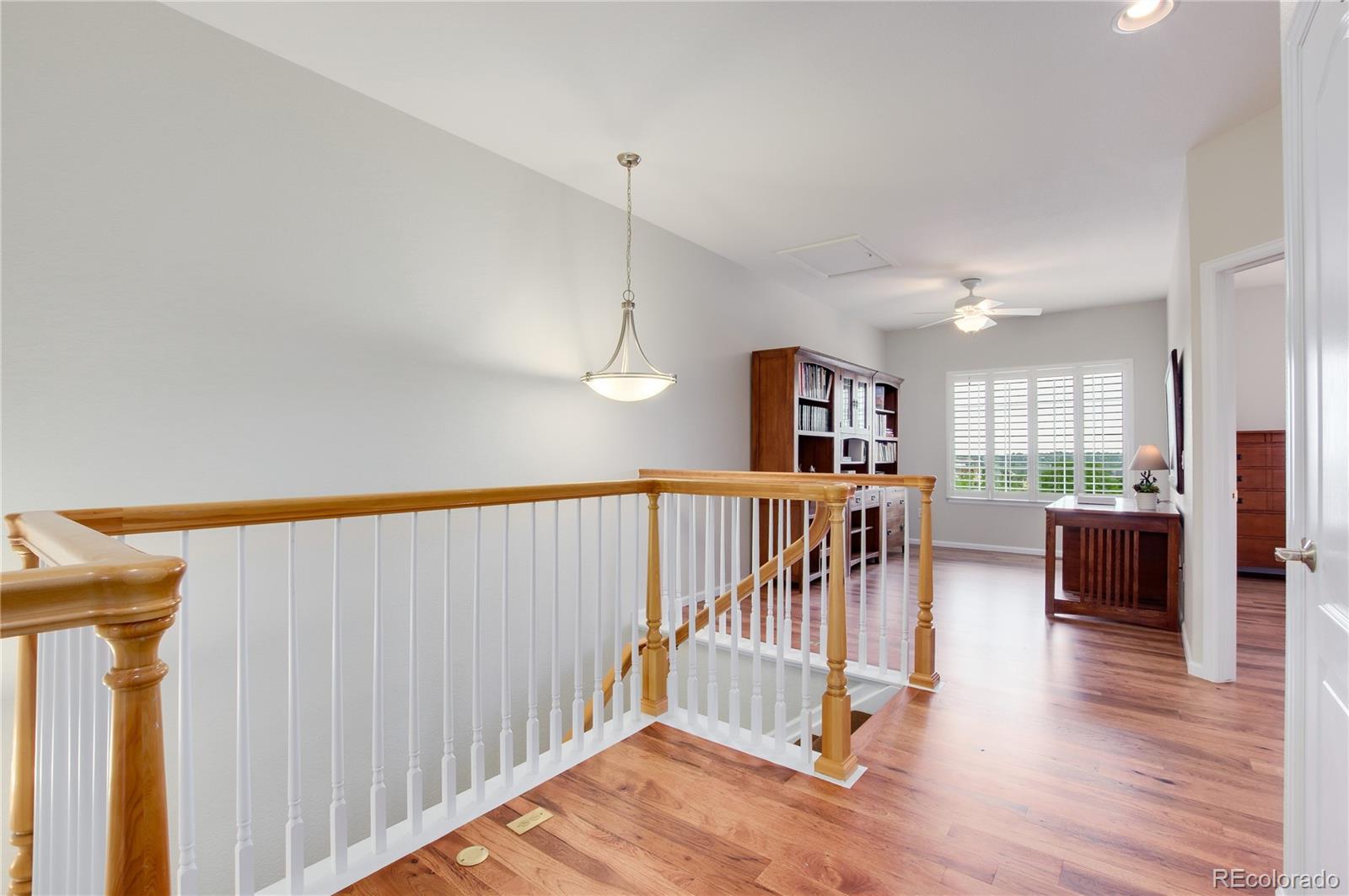624 Green Ash Street, Unit G Highlands Ranch, CO 80129 - Photo 12 of 40 a view of dinning room with wooden floor and windows