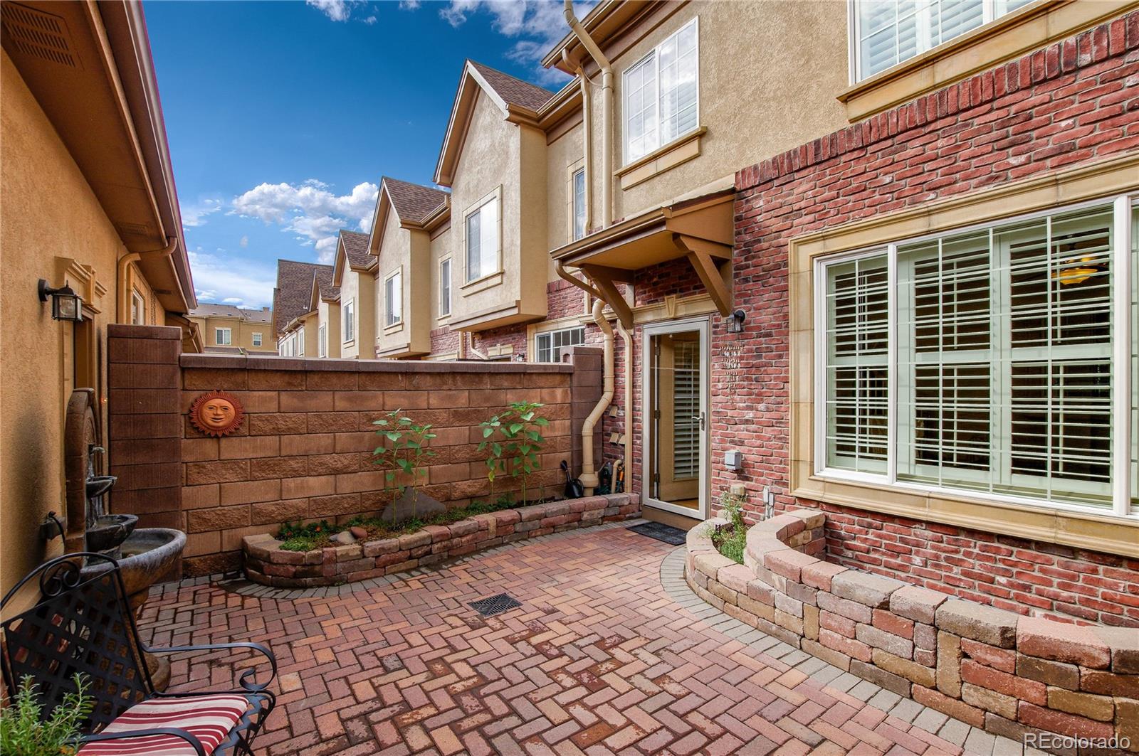 624 Green Ash Street, Unit G Highlands Ranch, CO 80129 - Photo 25 of 40 a front view of a house with a yard