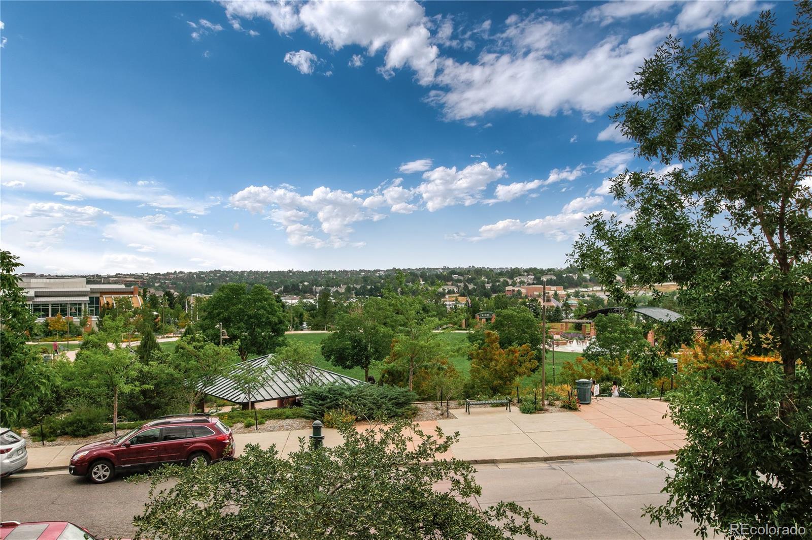 624 Green Ash Street, Unit G Highlands Ranch, CO 80129 - Photo 27 of 40 a car parked on the side of a road