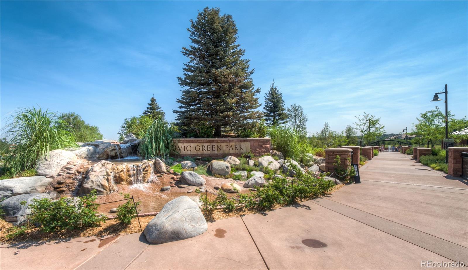 624 Green Ash Street, Unit G Highlands Ranch, CO 80129 - Photo 29 of 40 a view of a patio with table and chairs potted plants with sky view