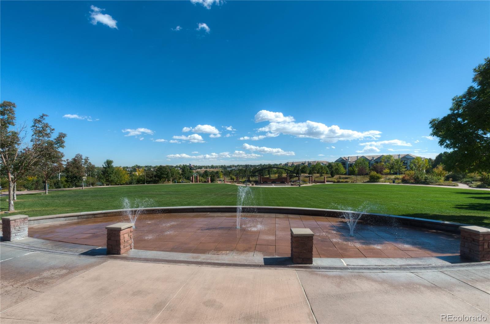 624 Green Ash Street, Unit G Highlands Ranch, CO 80129 - Photo 34 of 40 a view of a lake with a garden
