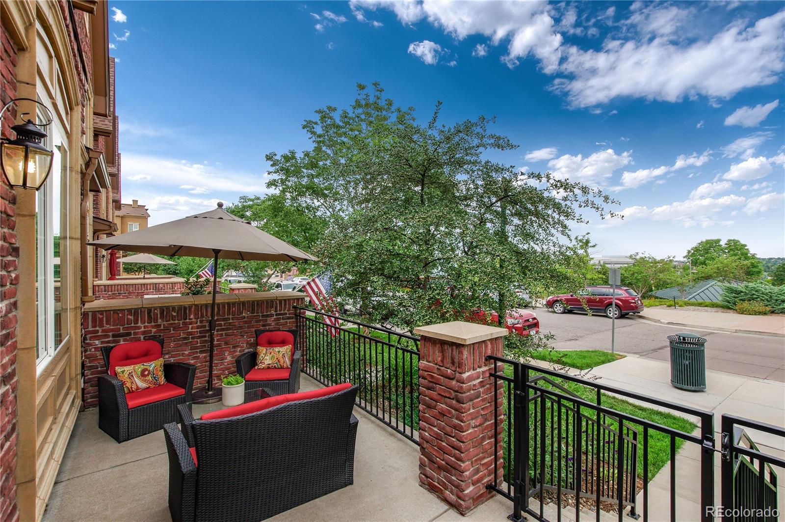 624 Green Ash Street, Unit G Highlands Ranch, CO 80129 - Photo 4 of 40 a view of a chairs and tables in the balcony