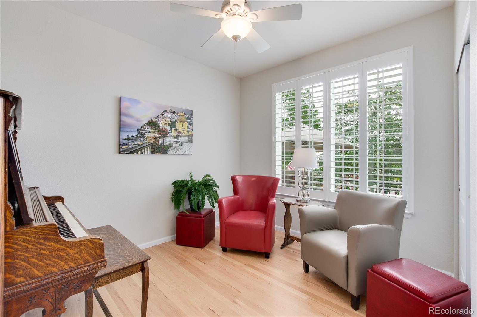 624 Green Ash Street, Unit G Highlands Ranch, CO 80129 - Photo 5 of 40 a living room with furniture and a large window