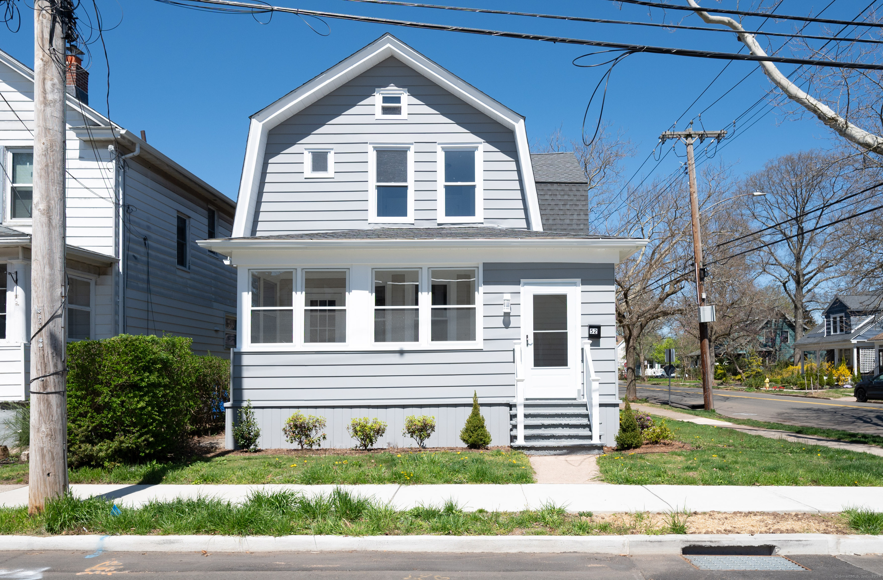 52 Beecher Place New Haven, CT 06512 - Photo 1 of 1 a front view of a house with a yard