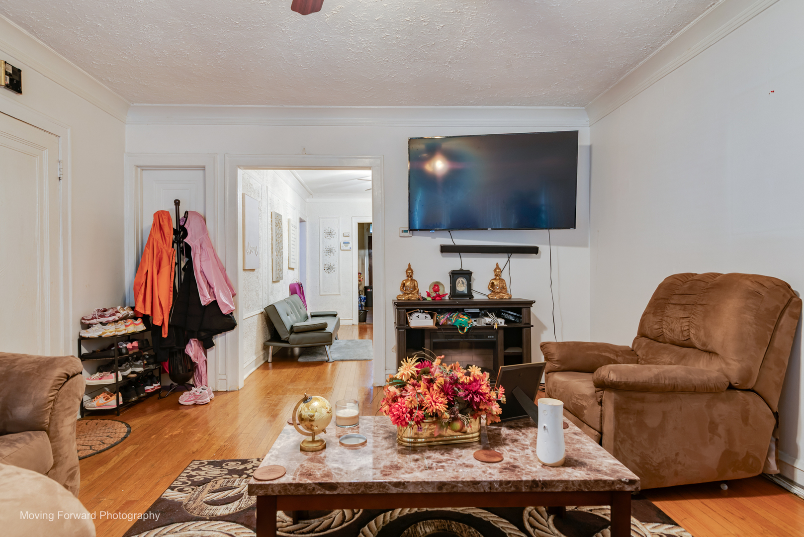 8213 South Indiana Avenue Chicago, IL 60619 - Photo 5 of 25 a living room with furniture and a flat screen tv