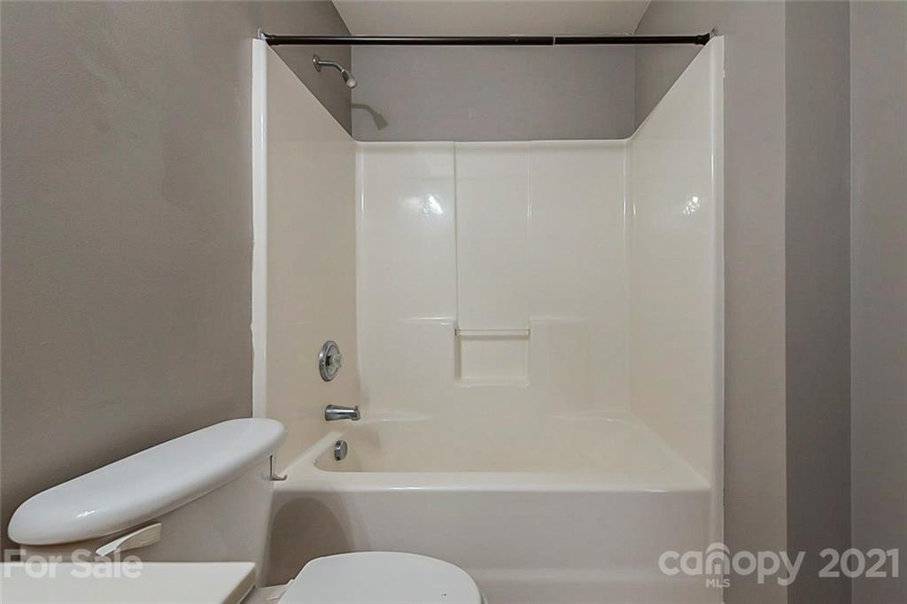 1906 Travertine Lane Fort Mill, SC 29708 - Photo 14 of 17 a bathroom with a toilet and a bathtub
