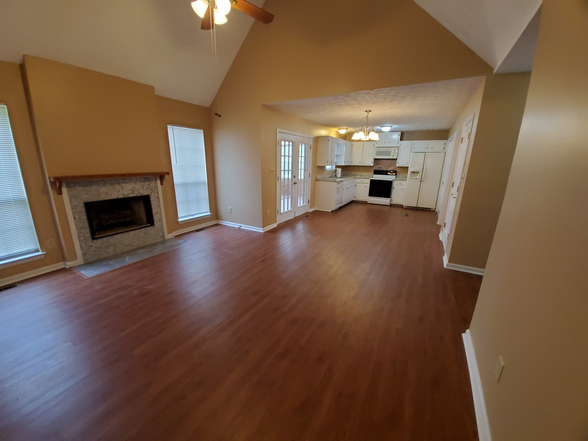 970 Chicken Road Lebanon, TN 37090 - Photo 8 of 11 wooden floor in an empty room with a fireplace