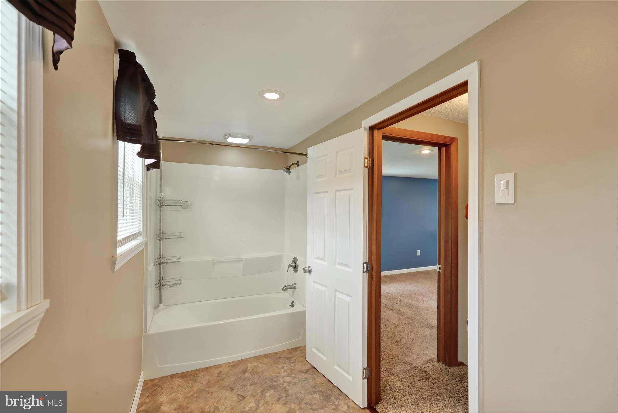 3027 Limekiln Road Birdsboro, PA 19508 - Photo 20 of 37 a bathroom with a bathtub and a shower