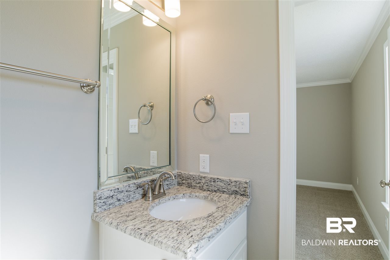 9141 Semmes Court Semmes, AL 36575 - Photo 15 of 28 En suite master bath with pretty granite vanity.