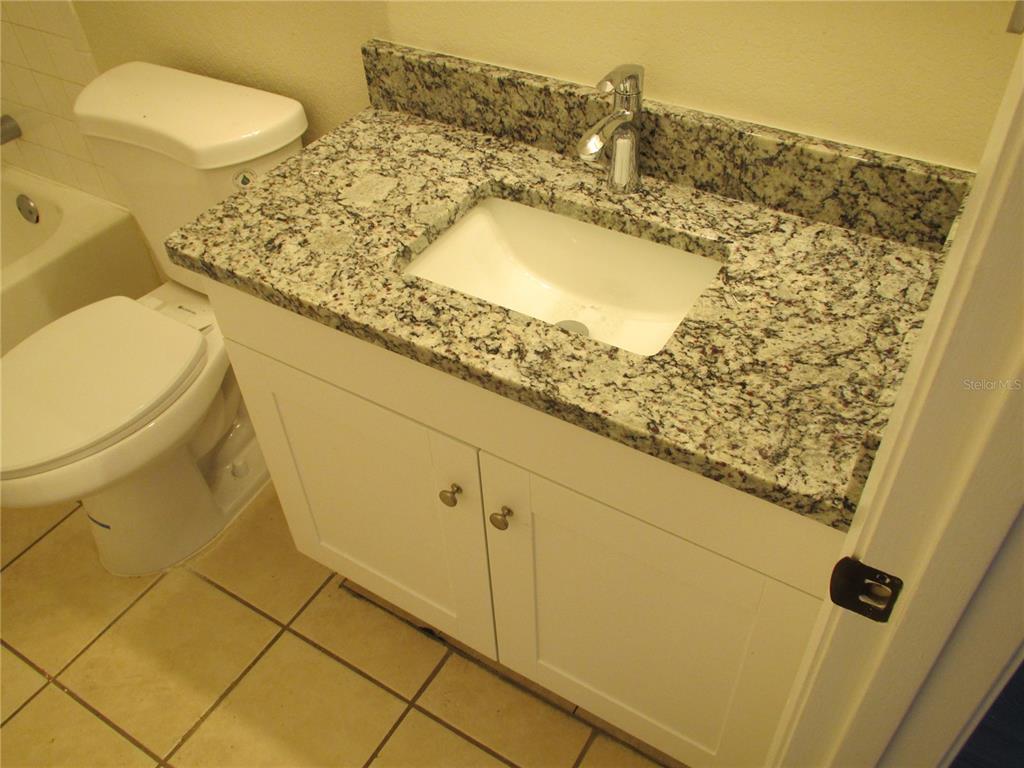 25100 Sandhill Boulevard, Unit 202 Punta Gorda, FL 33983 - Photo 12 of 12 a bathroom with a sink and a toilet