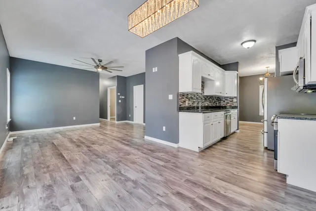 a view of a house with a big yard