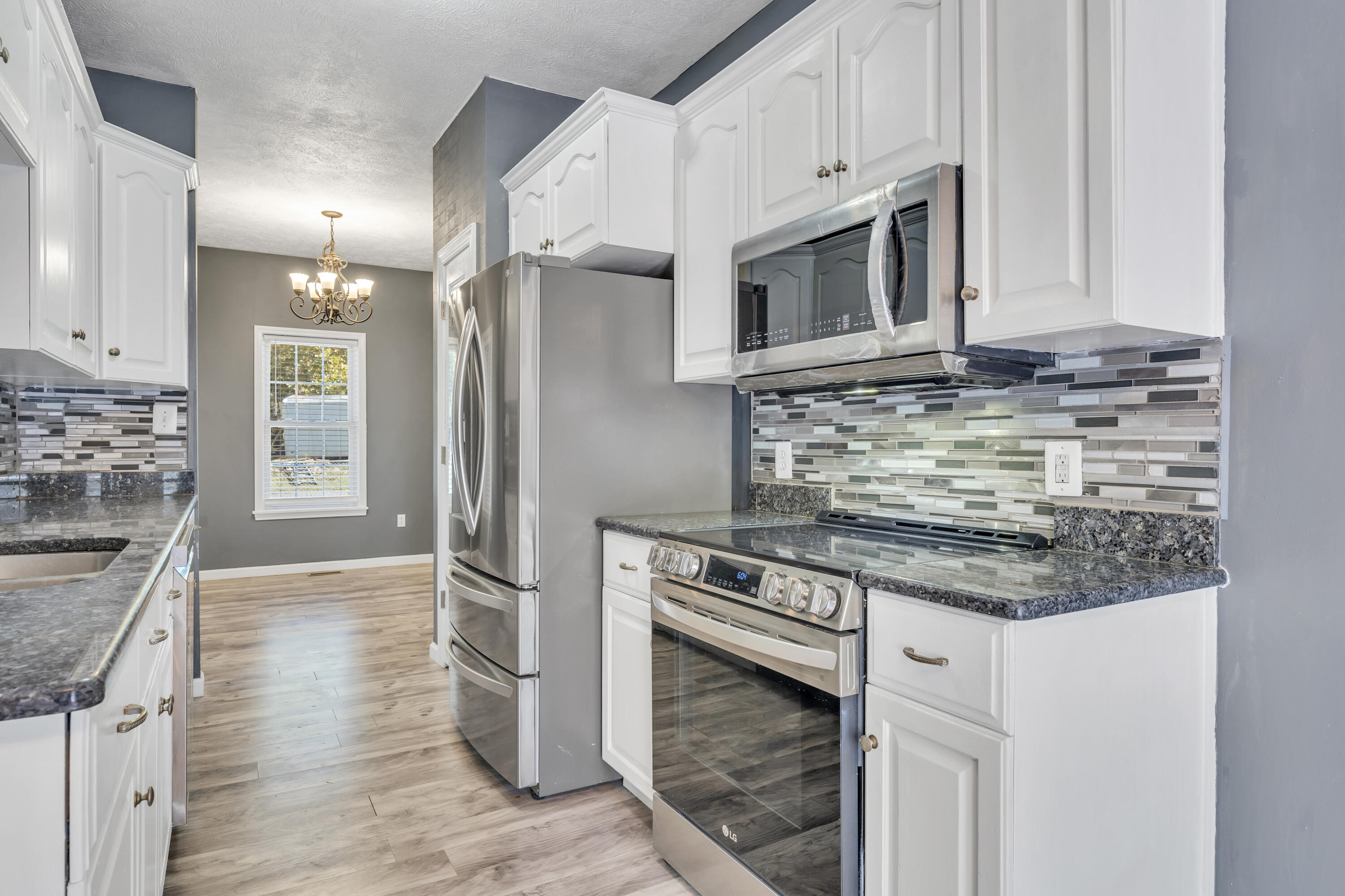 319 Cooks Knob Road Ferrum, VA 24088 - Photo 13 of 80 a kitchen with stainless steel appliances granite countertop a stove and a refrigerator