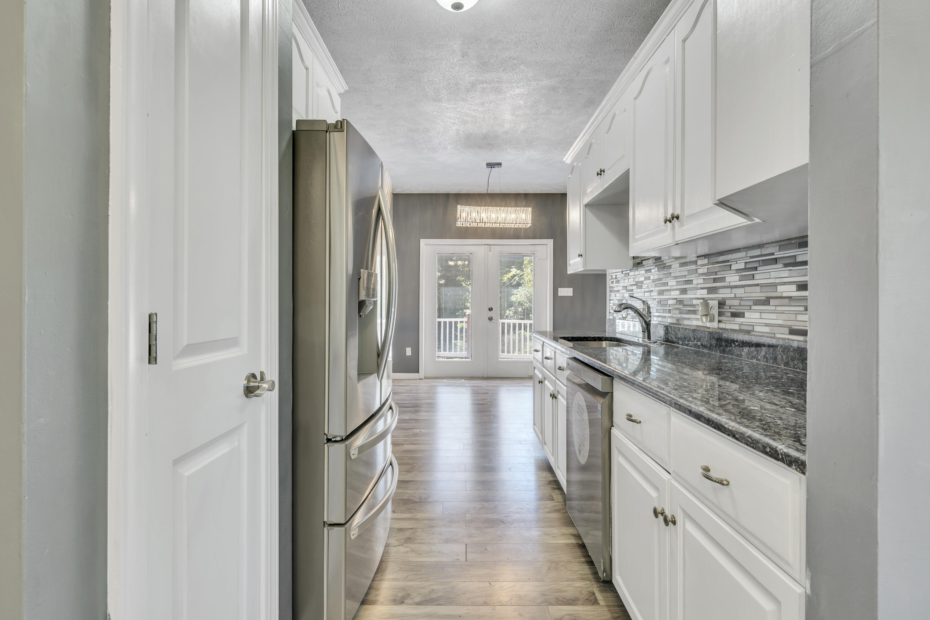 319 Cooks Knob Road Ferrum, VA 24088 - Photo 16 of 80 a large white kitchen with granite countertop a lot of counter space and a sink
