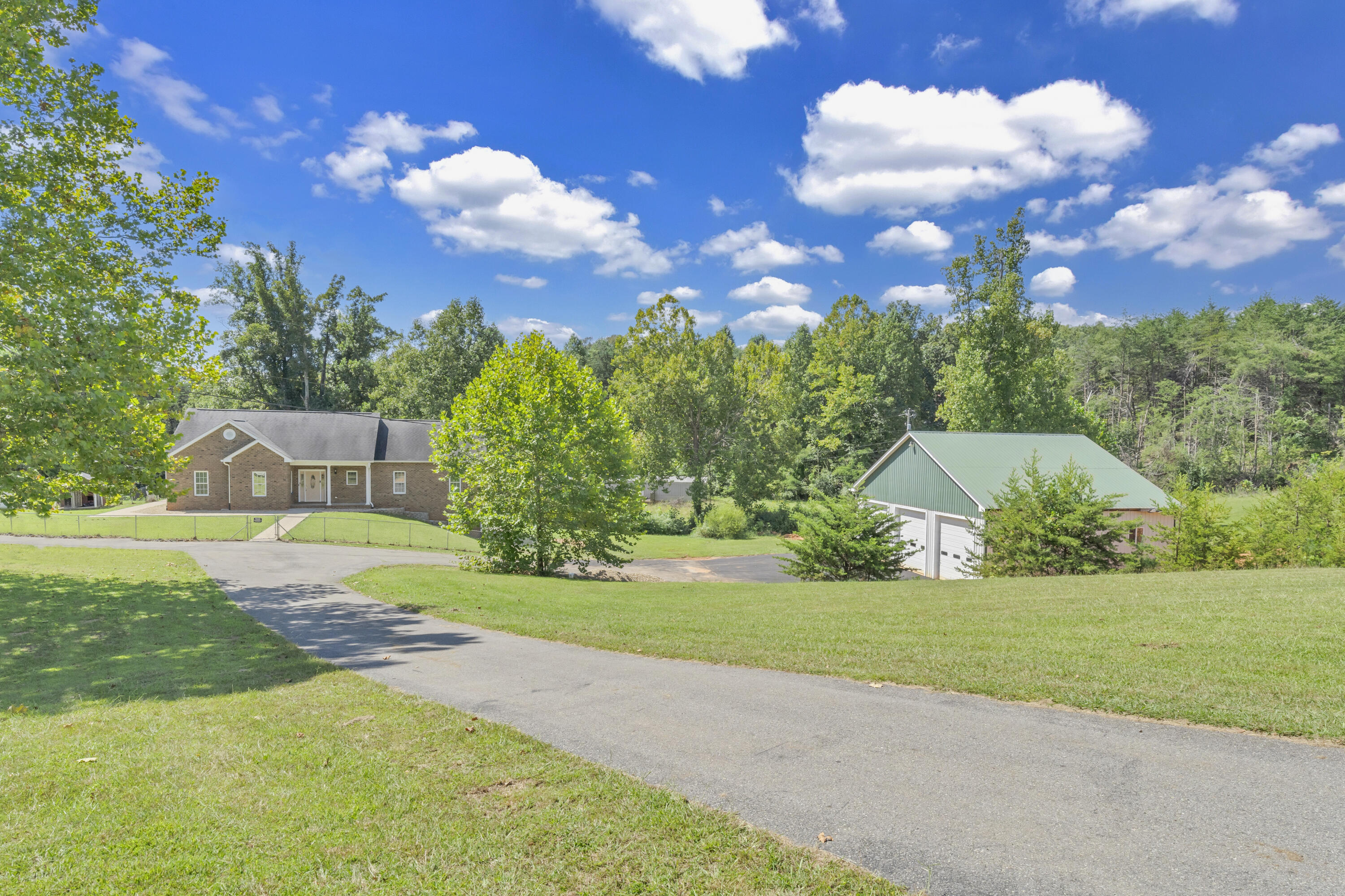 319 Cooks Knob Road Ferrum, VA 24088 - Photo 21 of 80 a view of a house with a big yard and large trees