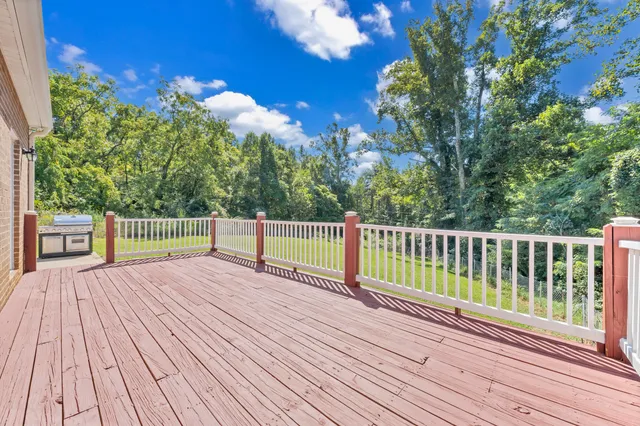 a room with pool table and windows